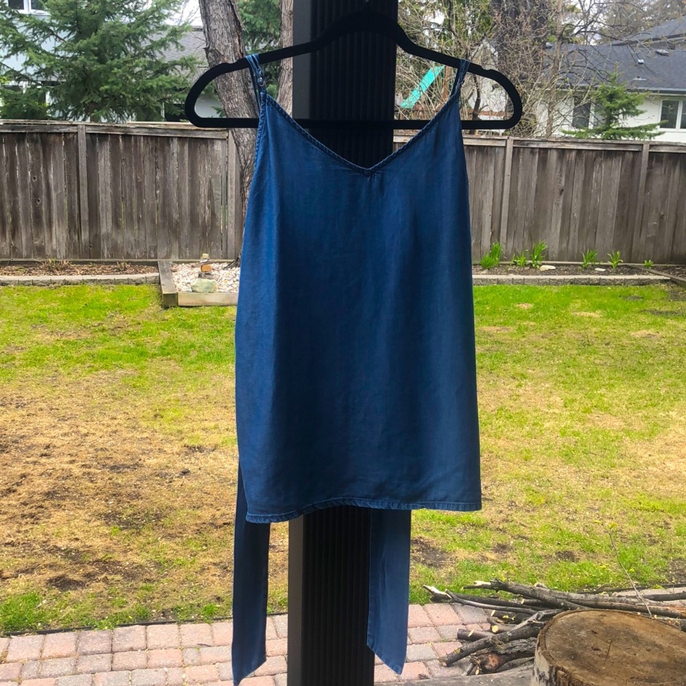 Blue, medium sized “1250 degrees Celsius” tank top. New condition.